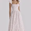 Livia Midi-Sommerkleid aus Baumwolle mit weißem Rosenprint Livia Midi-Sommerkleid aus Baumwolle mit weißem Rosenprint