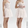 Louisa Vintage Mini-Kleid aus cremefarbener Spitze Louisa Vintage Mini-Kleid aus cremefarbener Spitze