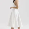 Loulou Midi-Kleid in Elfenbein mit Neckholder Loulou Midi-Kleid in Elfenbein mit Neckholder