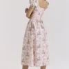 Lulabell Midi-Kleid aus Baumwolle mit rosa Schleifenprint Lulabell Midi-Kleid aus Baumwolle mit rosa Schleifenprint