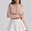 Lumi Weiße Baumwoll-Mini-Shorts mit ausgestelltem Bein Lumi Weiße Baumwoll-Mini-Shorts mit ausgestelltem Bein