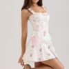 Marianella Mini-Kleid aus Stretch-Baumwolle mit cremefarbenem Rosenprint Marianella Mini-Kleid aus Stretch-Baumwolle mit cremefarbenem Rosenprint