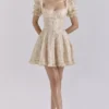 Melita Cremefarbenes Minikleid aus Chiffon mit Blumenprint und Puffärmeln Melita Cremefarbenes Minikleid aus Chiffon mit Blumenprint und Puffärmeln