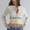 Mistle-Bow Cremefarbene Jacquard-Strickjacke Mistle-Bow Cremefarbene Jacquard-Strickjacke