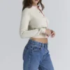 Mistle-Bow Cremefarbene Jacquard-Strickjacke Mistle-Bow Cremefarbene Jacquard-Strickjacke