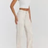 Mistress Rocks Cremefarbene Jeans mit verstaubtem Print und ausgefransten Säumen – Sale
