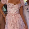 Penelope Midi-Kleid aus Georgette mit weißem Rosenprint und Schleifen Penelope Midi-Kleid aus Georgette mit weißem Rosenprint und Schleifen