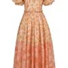 Penelope Pfirsichfarbenes Midi-Sommerkleid mit Poppy-Print und Puffärmeln Penelope Pfirsichfarbenes Midi-Sommerkleid mit Poppy-Print und Puffärmeln
