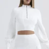 Reeva Weißer Pullover mit Ballonärmeln und Rippmuster Reeva Weißer Pullover mit Ballonärmeln und Rippmuster