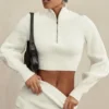 Reeva Weißer Pullover mit Ballonärmeln und Rippmuster Reeva Weißer Pullover mit Ballonärmeln und Rippmuster