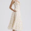 Rosalee – Elfenbeinfarbenes Baumwoll-Bustier-Sommerkleid mit Wiesenmuster Rosalee – Elfenbeinfarbenes Baumwoll-Bustier-Sommerkleid mit Wiesenmuster