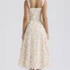Rosalee – Elfenbeinfarbenes Baumwoll-Bustier-Sommerkleid mit Wiesenmuster Rosalee – Elfenbeinfarbenes Baumwoll-Bustier-Sommerkleid mit Wiesenmuster