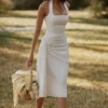 Tallulah – Weißes Midi-Kleid aus Baumwolle mit Neckholder Tallulah – Weißes Midi-Kleid aus Baumwolle mit Neckholder